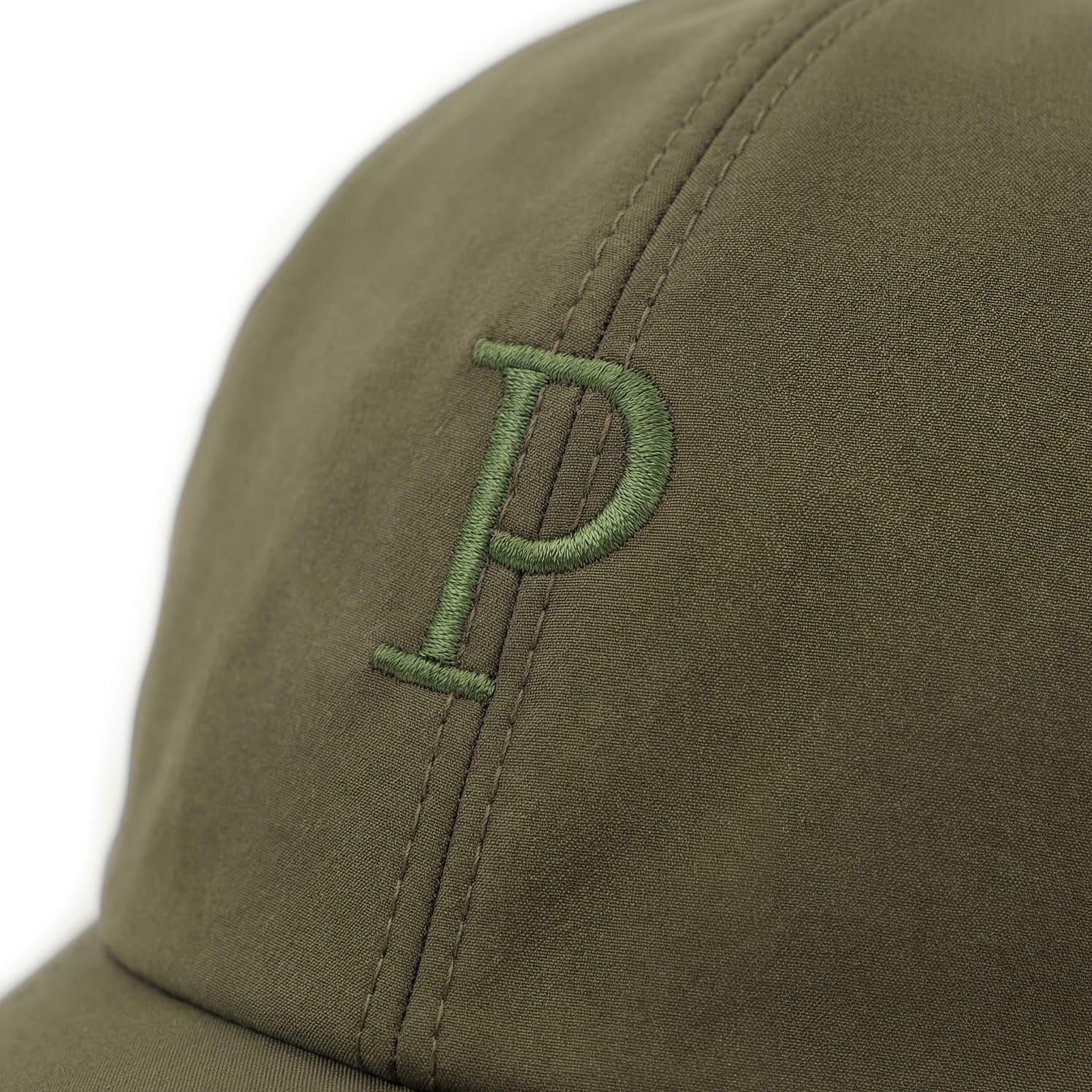 Green cap with a logo on a white background