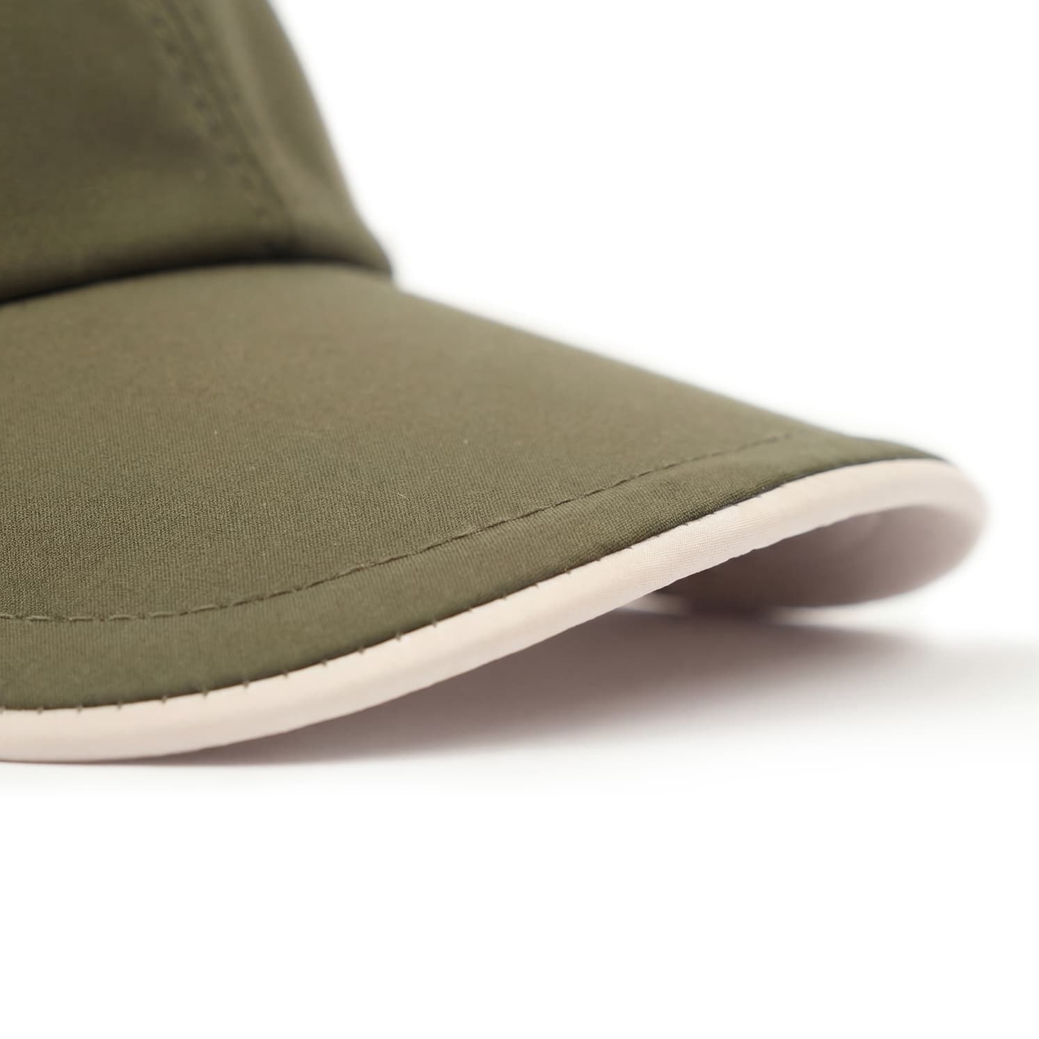 Green cap with a white rim on a white background