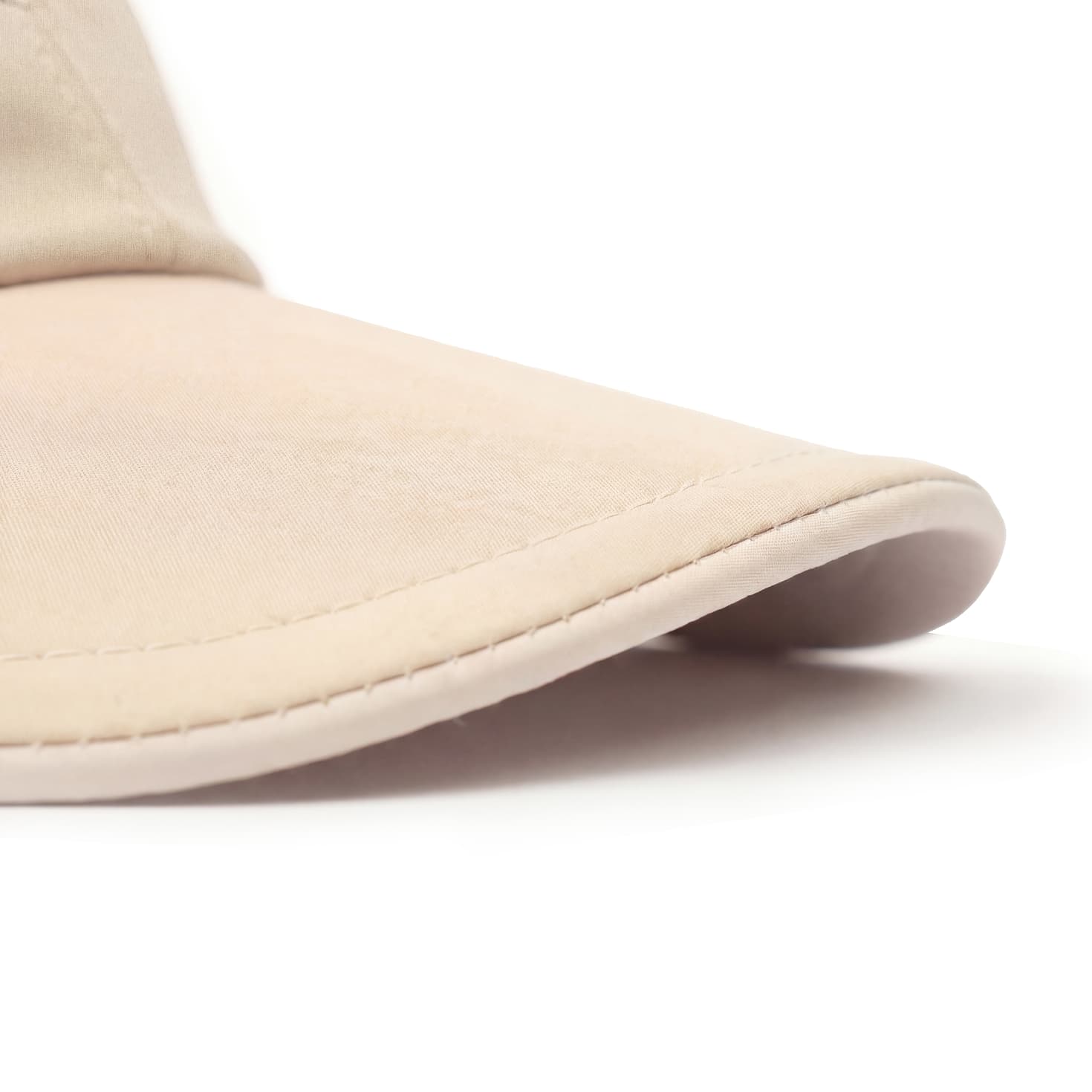 Beige visor cap on a white background
