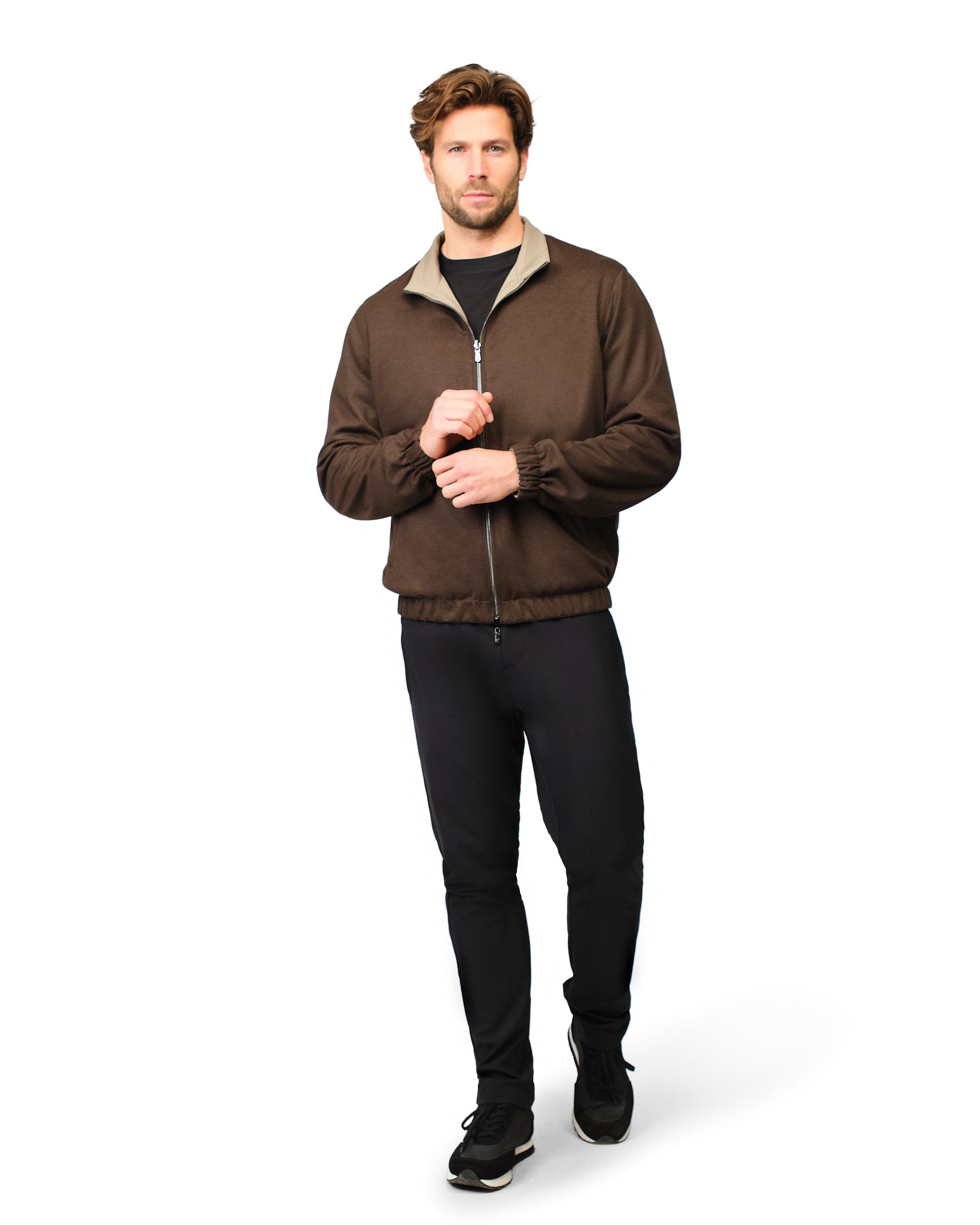 Man wearing a brown jacket with a white background