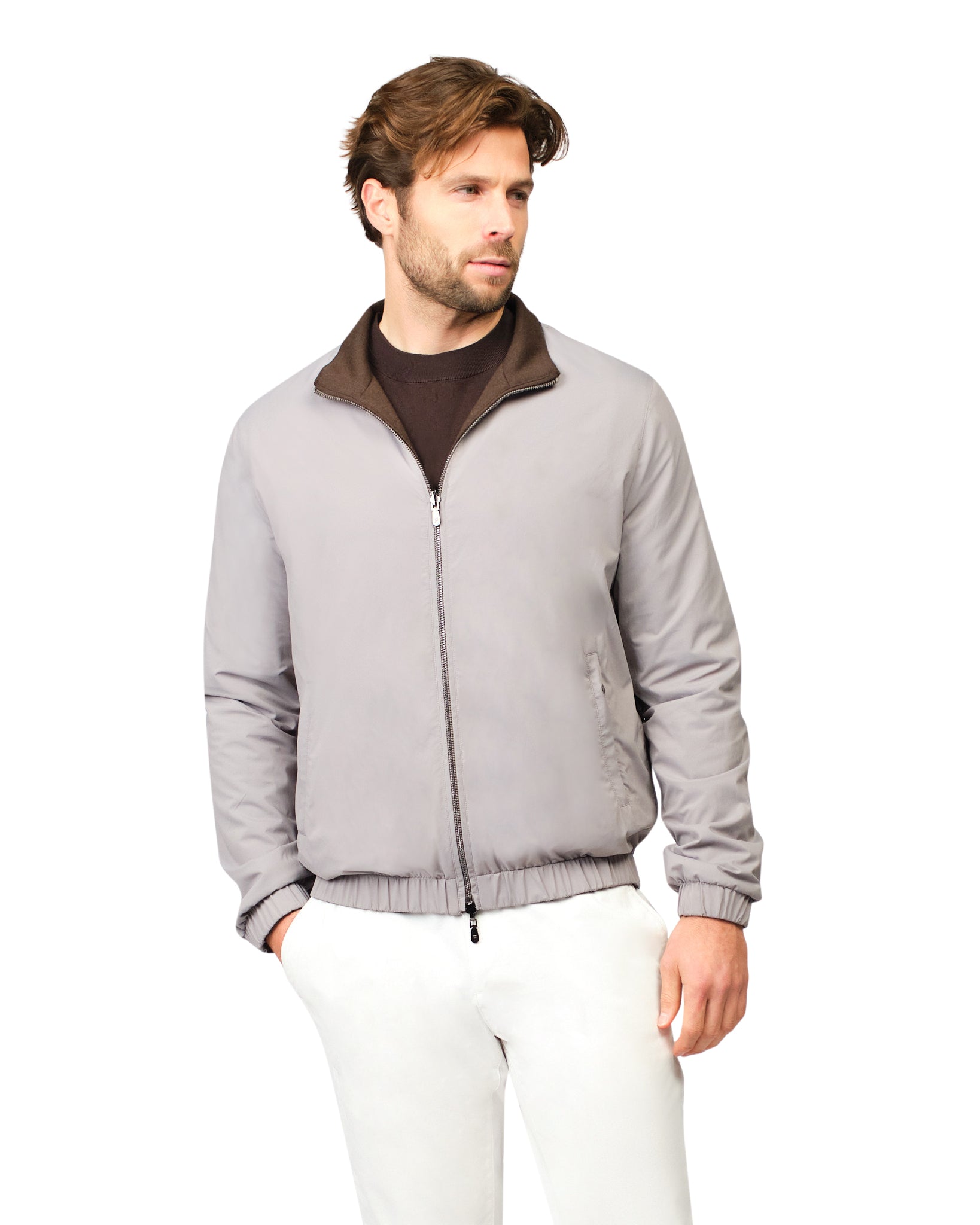 Man wearing a gray jacket with a brown collar