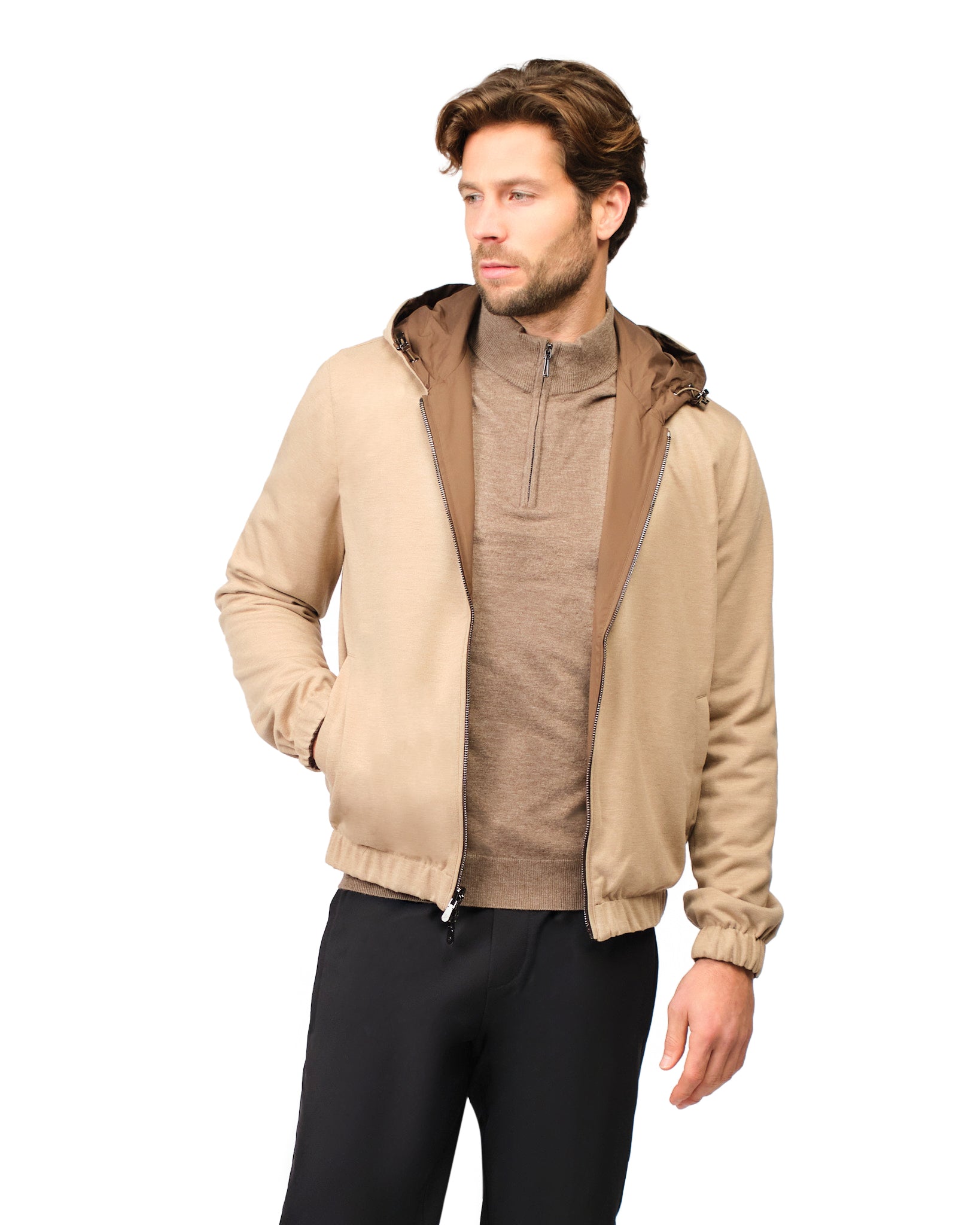 Man wearing a beige jacket with a hood on a white background