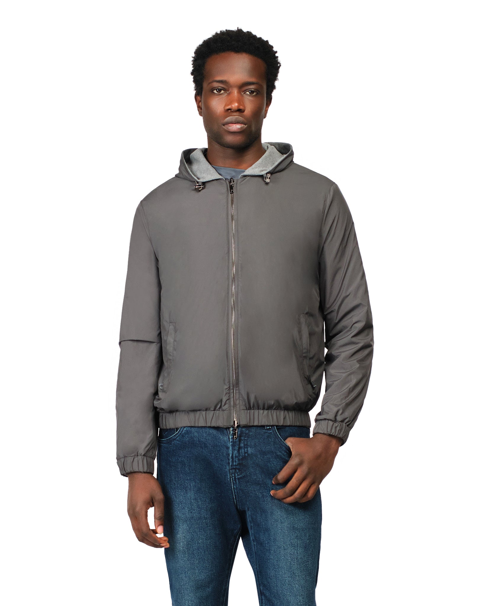 Man wearing a gray jacket with a hood on a white background