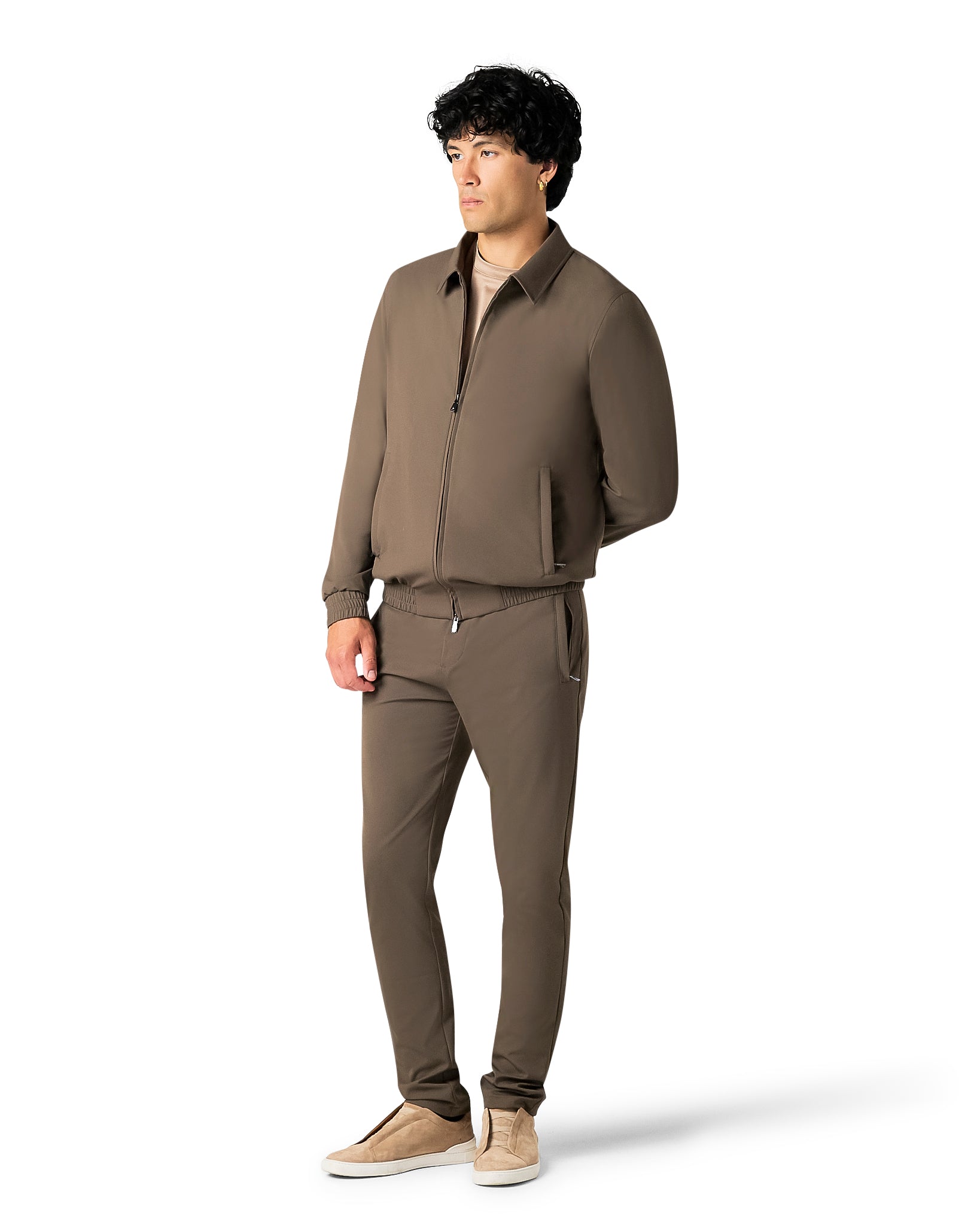 Man wearing a brown outfit on a white background