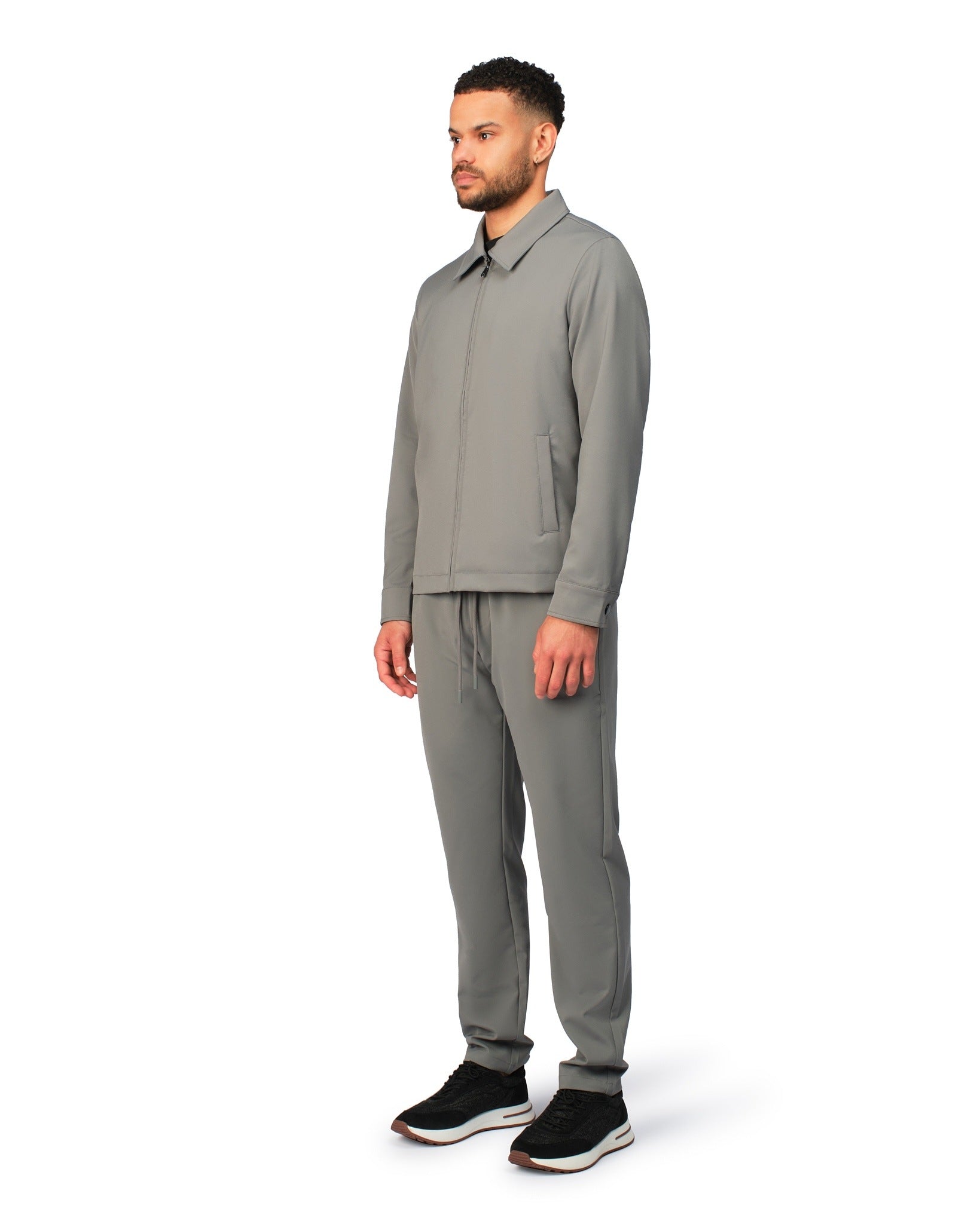 Grey tech jacket with modern design and front zipper, detailed product view.