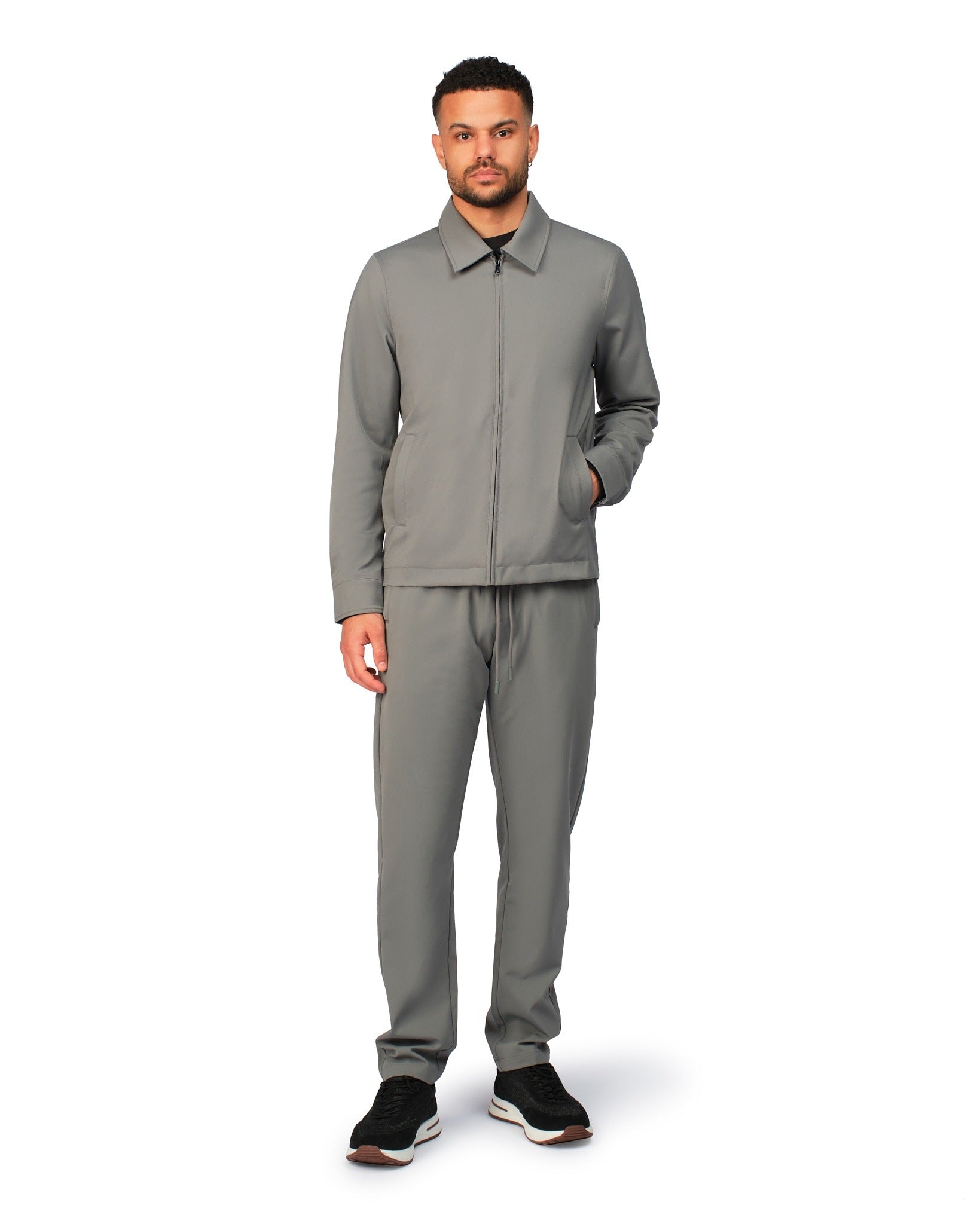 Grey tech jacket with modern design and front zipper, detailed product view.