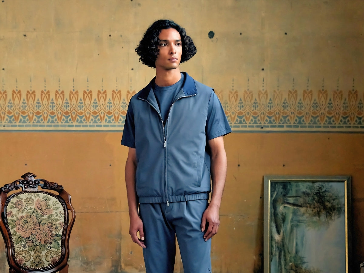 Man styling a bodywarmer over a knit — bodywarmer outfit men 2026