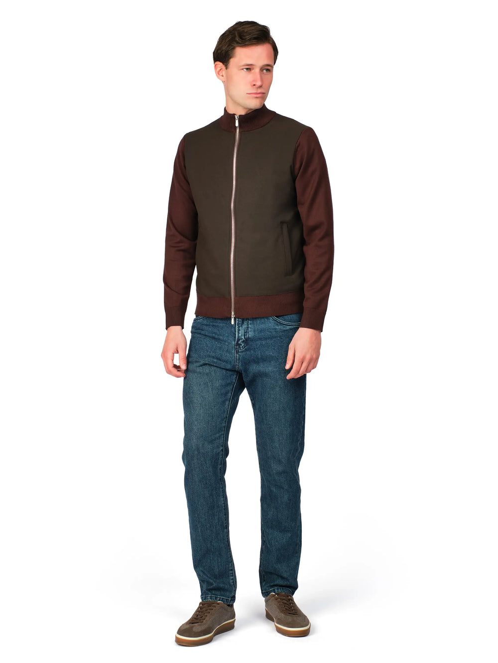 Man wearing a brown jacket and blue jeans on a white background