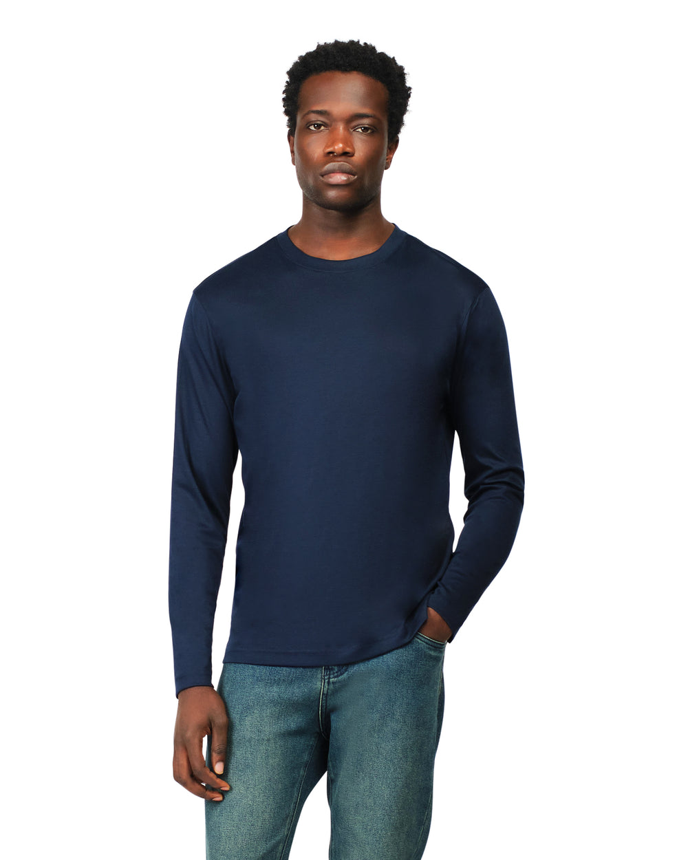 Man wearing a navy long-sleeve shirt and jeans on a white background