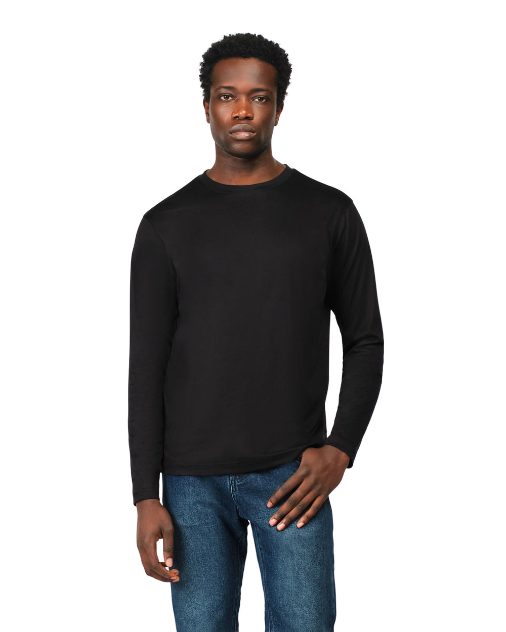 Man wearing a black long-sleeve shirt and blue jeans on a white background
