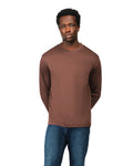 Man wearing a brown long-sleeve shirt and blue jeans on a white background