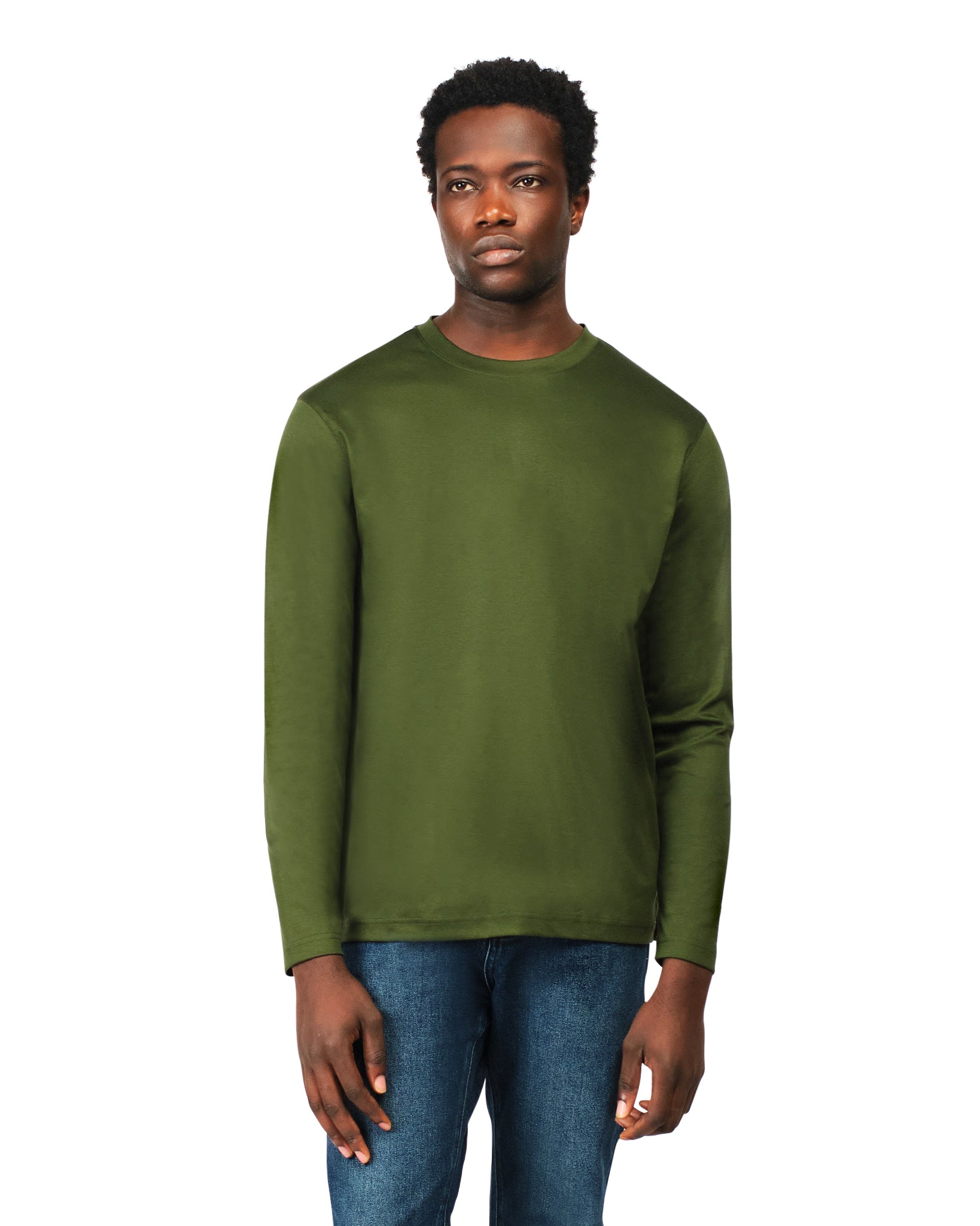 Man wearing a green sweatshirt and blue jeans on a white background