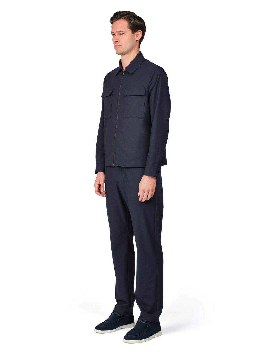 Man wearing a navy blue outfit on a white background