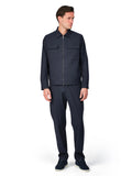 Man wearing a navy blue jacket and pants on a white background
