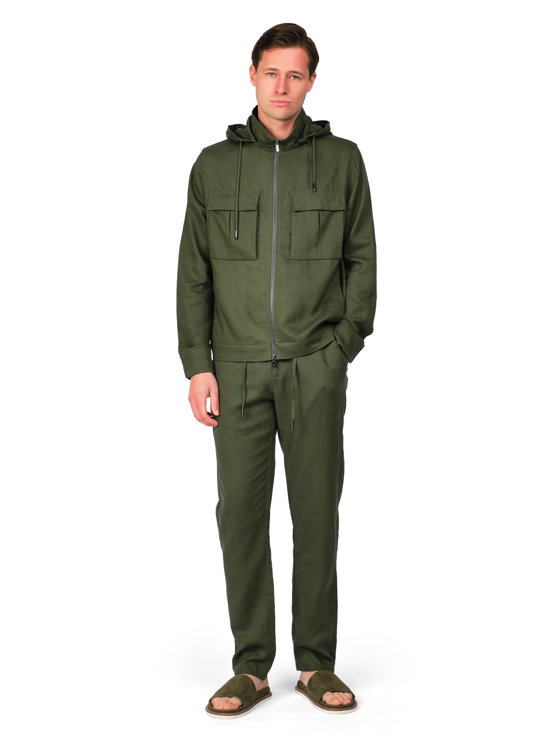 Man wearing a green jumpsuit on a white background