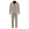 Beige jumpsuit with black collar on a white background