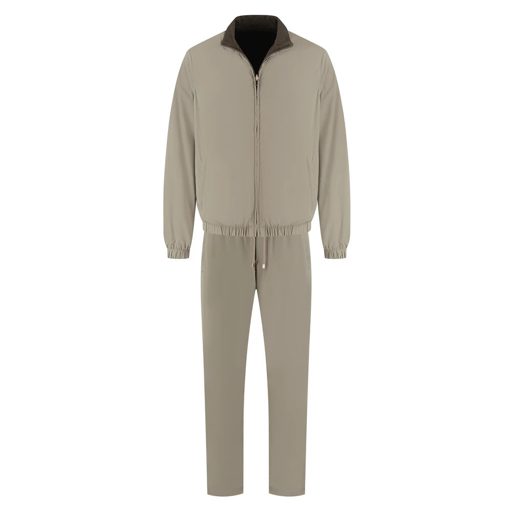 Beige jumpsuit with black collar on a white background