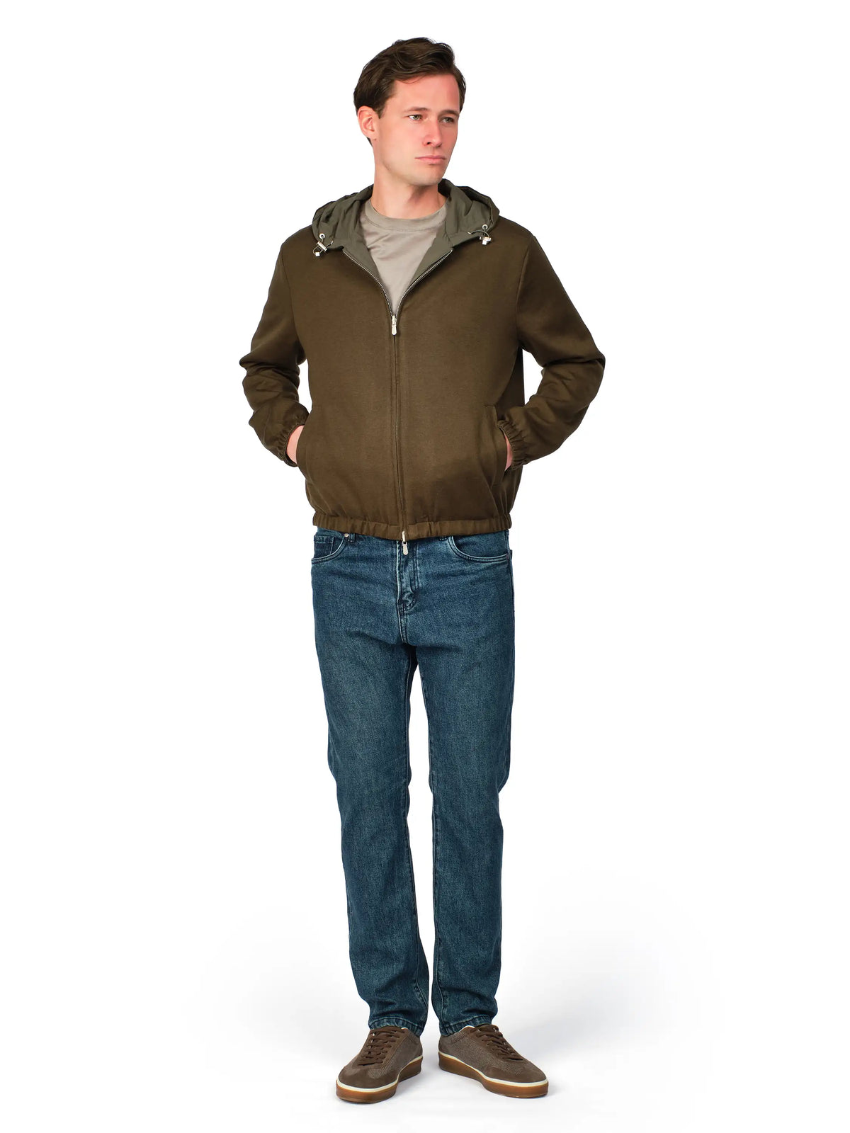 Man wearing a brown jacket with a hood, gray shirt, blue jeans, and brown shoes on a white background