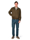 Man wearing a brown jacket and blue jeans on a white background