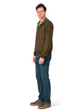 Man wearing a green jacket and blue jeans on a white background
