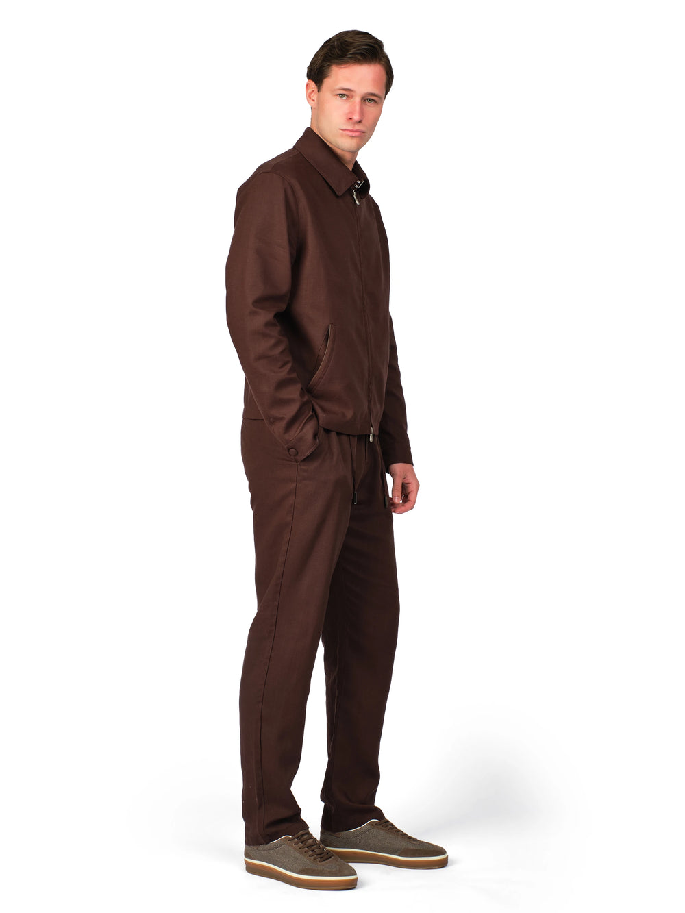 Man wearing a brown jumpsuit on a white background