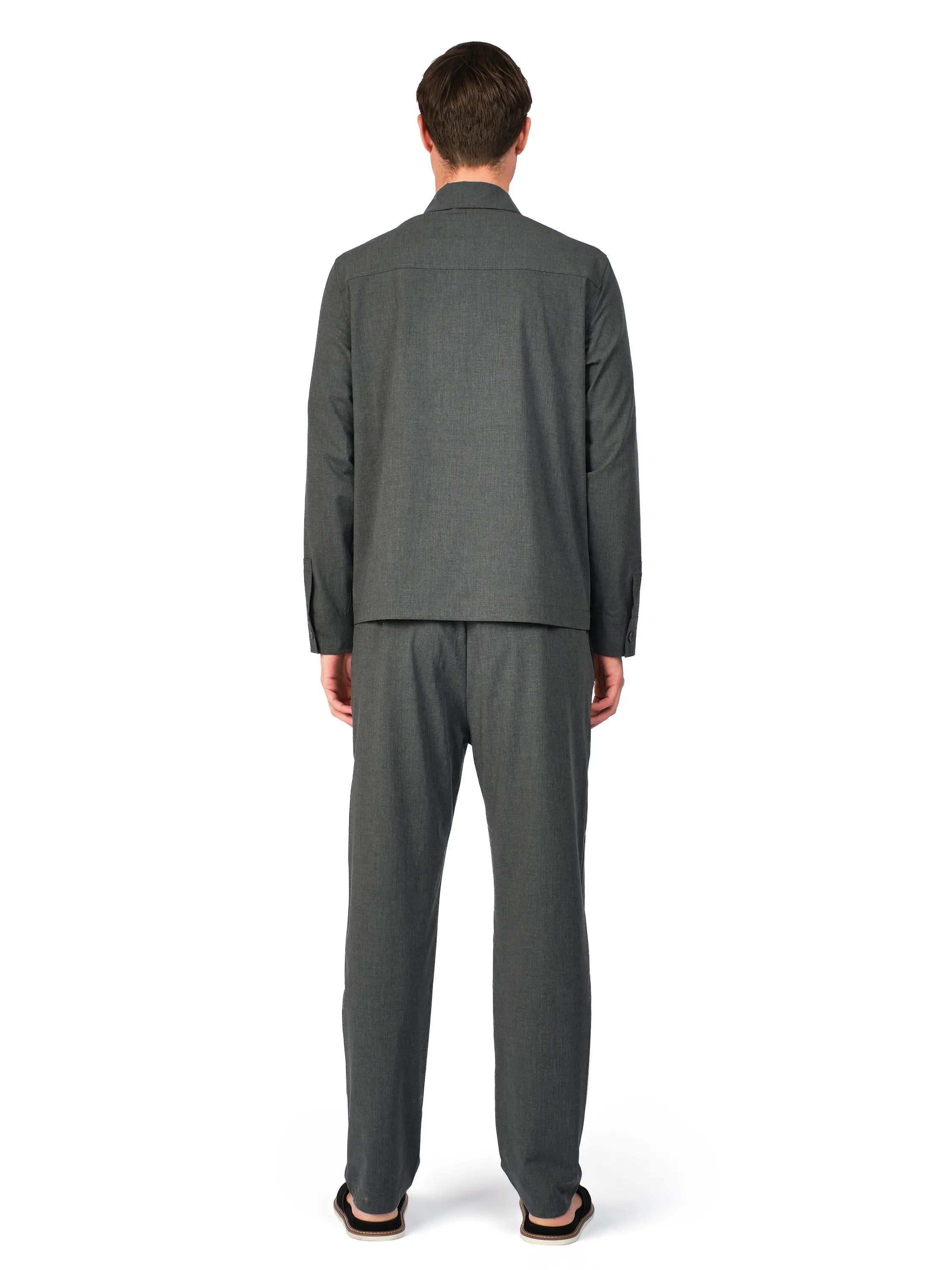 Man wearing a gray suit on a white background