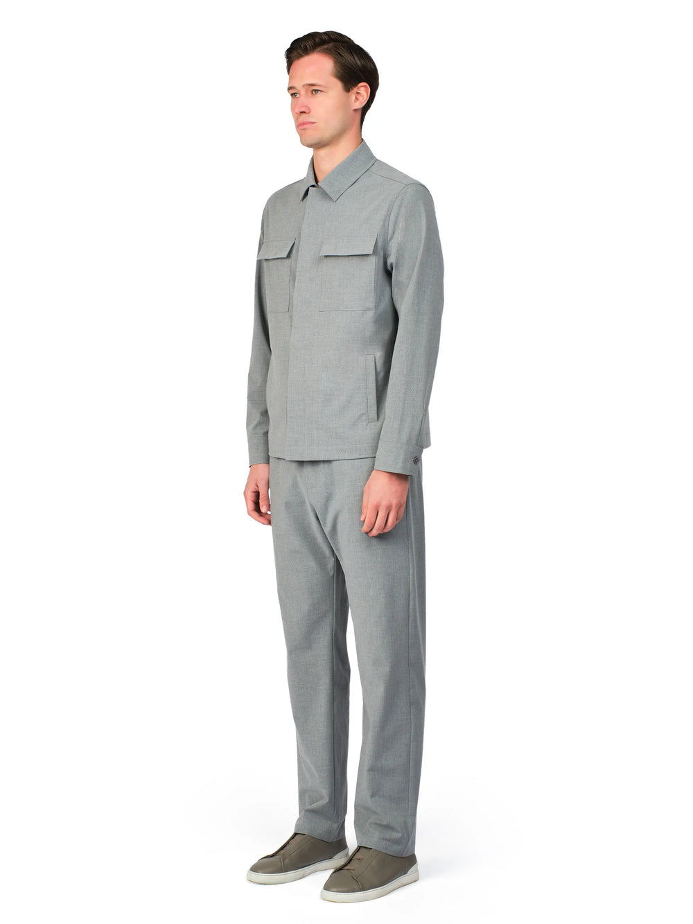 Man wearing a gray work uniform on a white background
