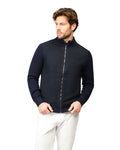 Man wearing a navy blue zip-up sweater over a white shirt on a white background