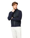 Man wearing a navy blue jacket on a white background