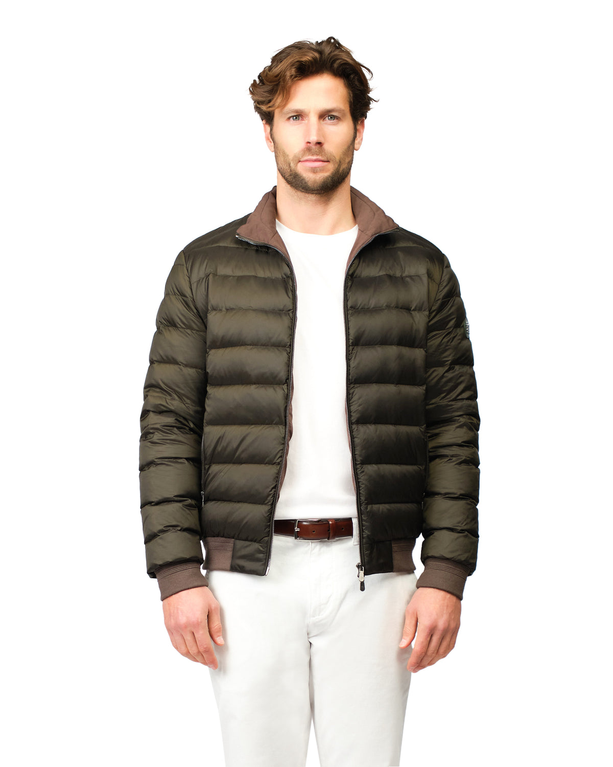 Man wearing a green puffer jacket on a white background