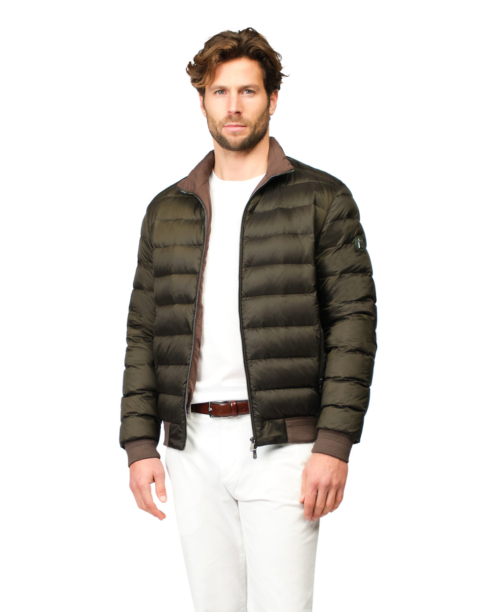 Man wearing a green puffer jacket on a white background