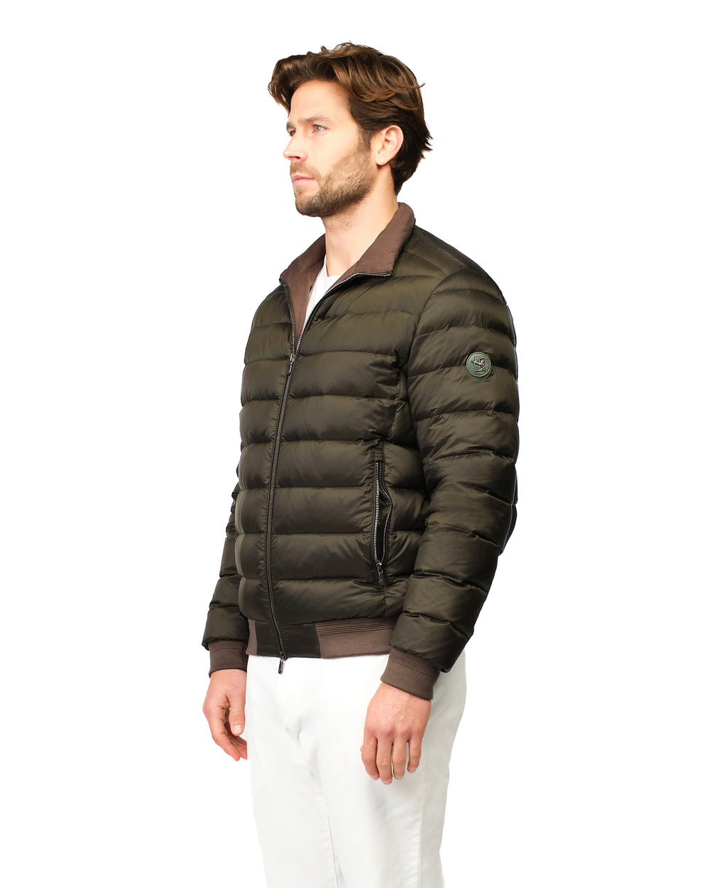 Man wearing a green puffer jacket on a white background
