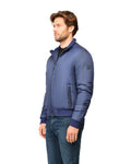 Man wearing a blue jacket on a white background