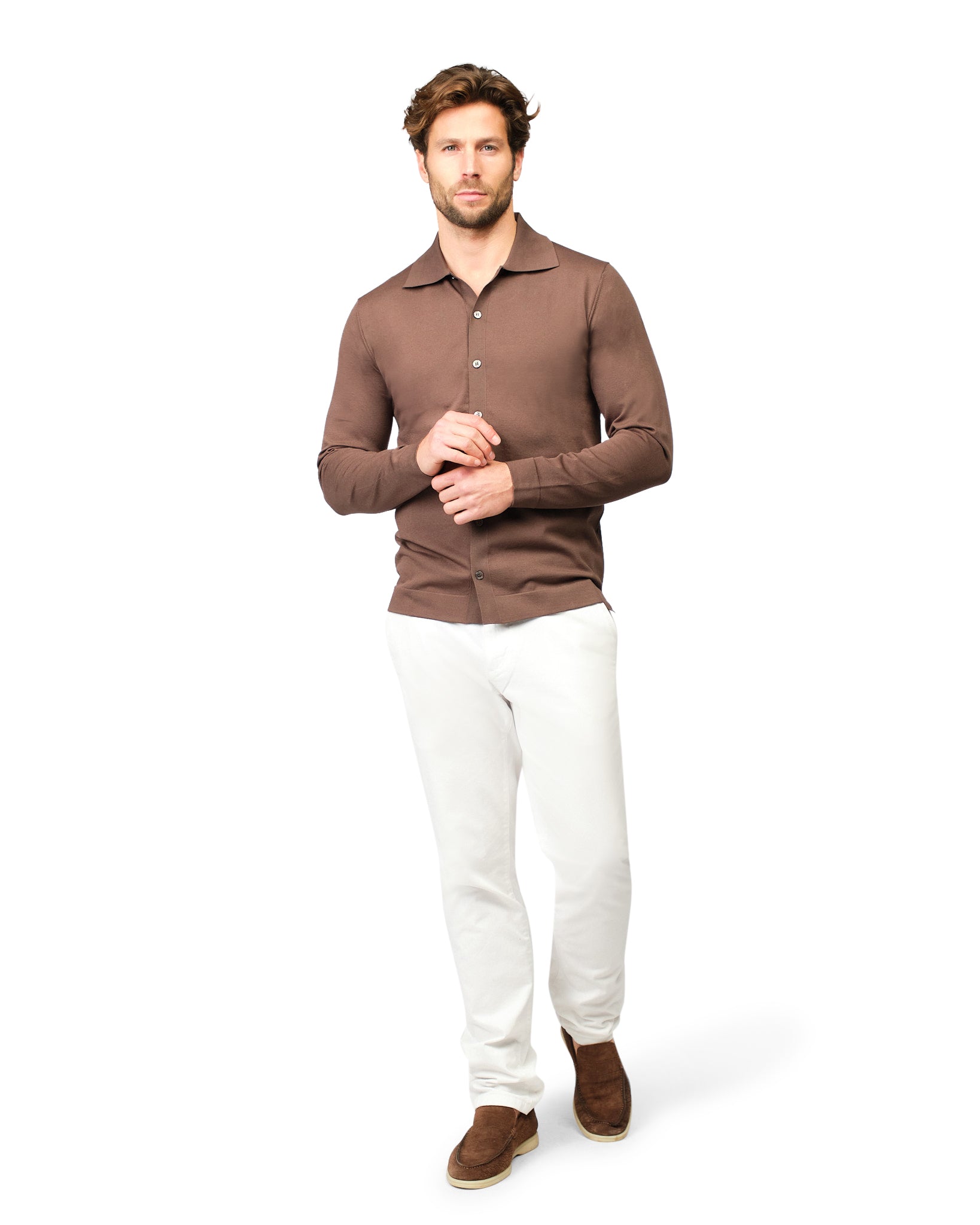 Man wearing a brown polo shirt and white pants on a white background