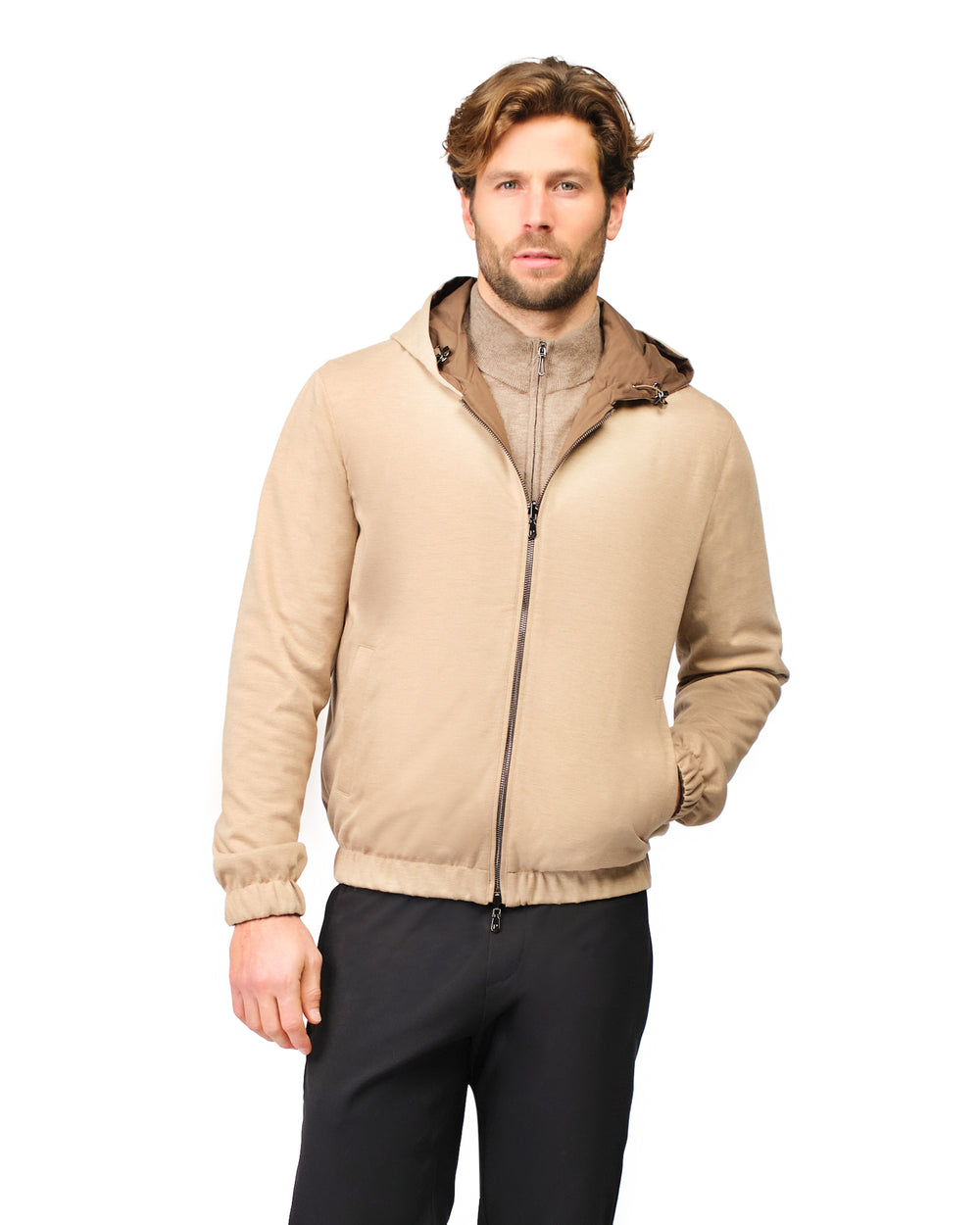 Man wearing a beige jacket with a white background
