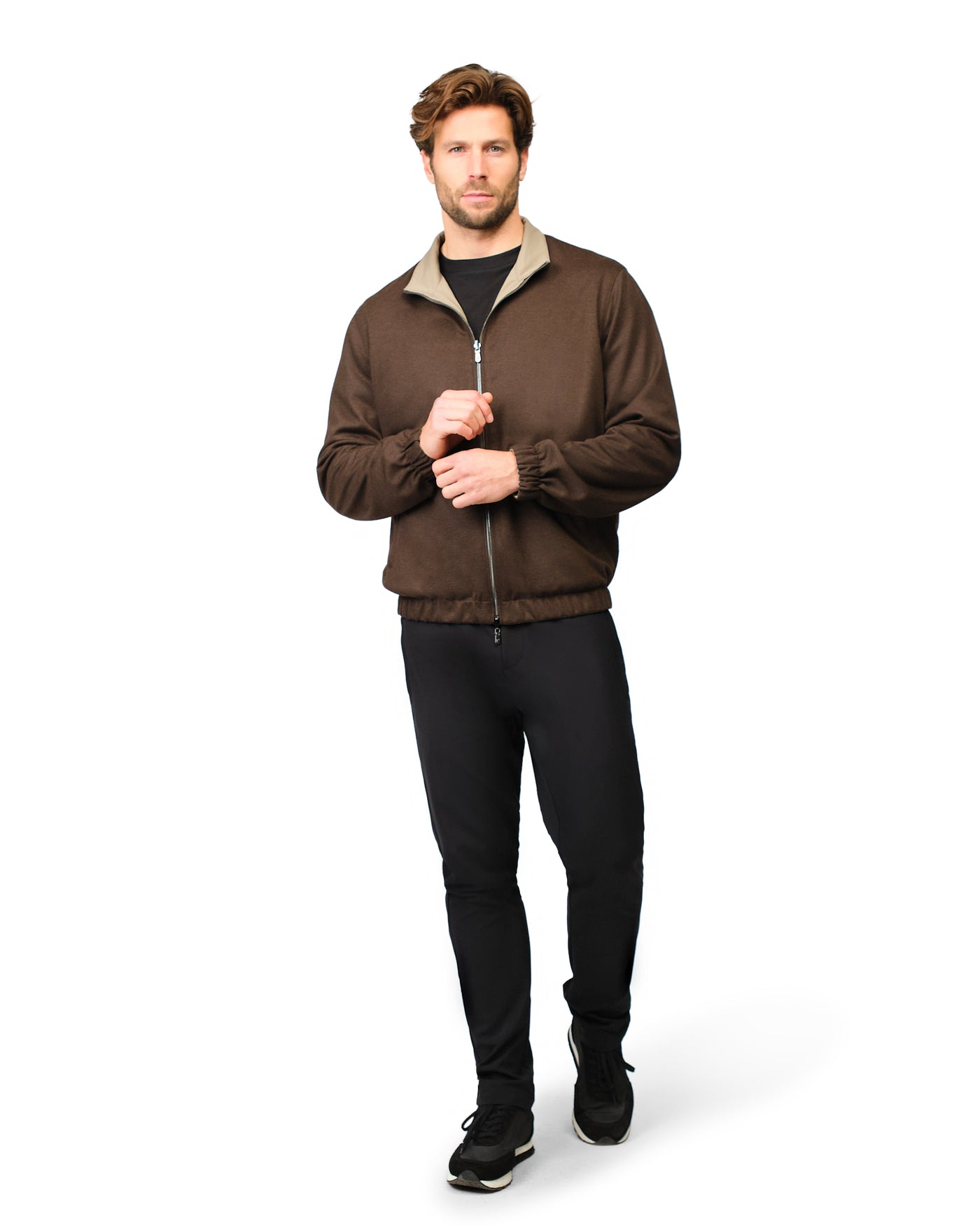 Man wearing a brown jacket with a white background