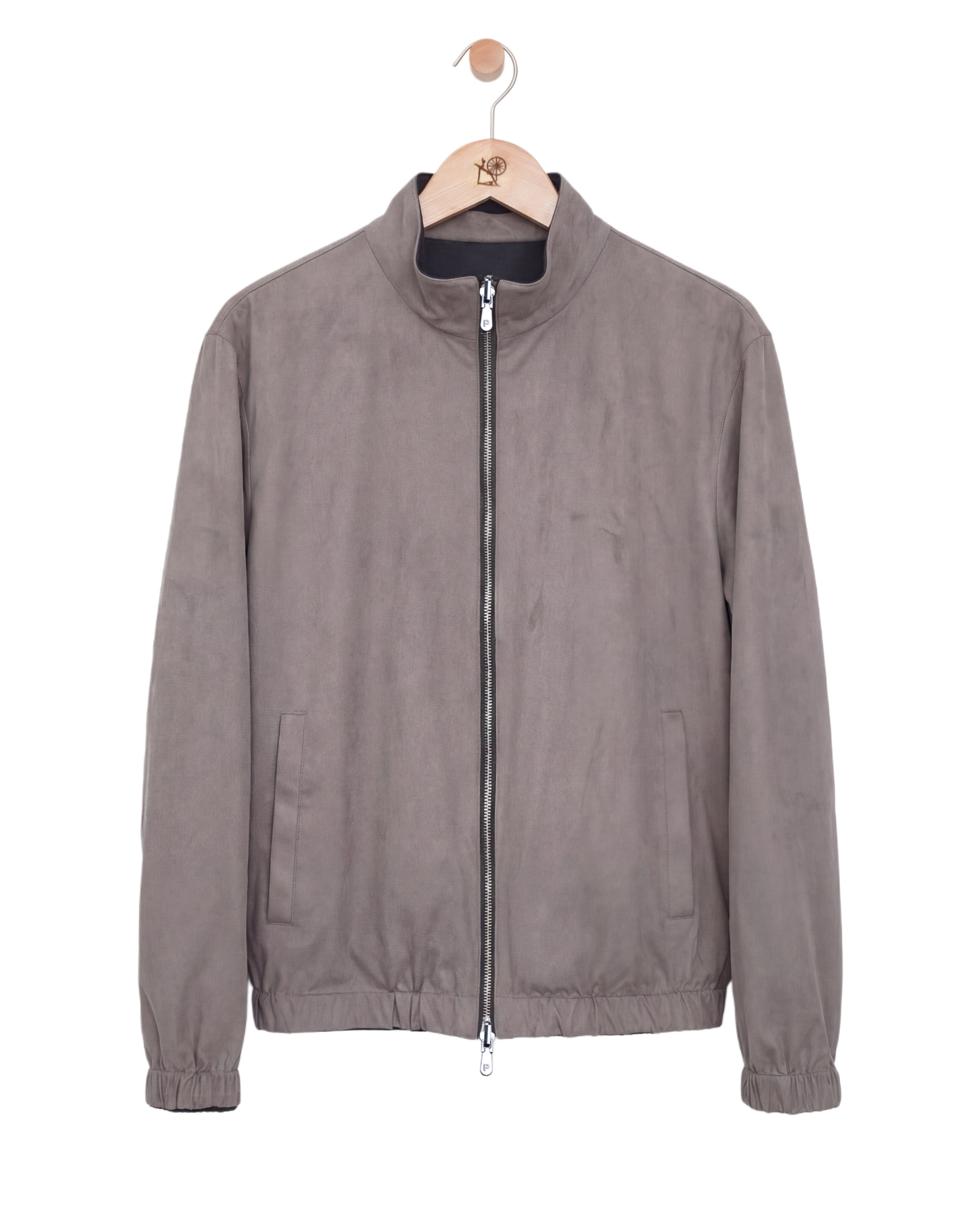 Gray jacket on a hanger against a white background
