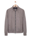Gray jacket on a hanger against a white background