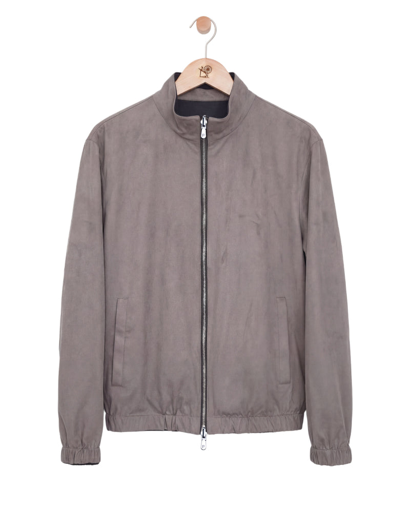 Gray jacket on a hanger against a white background