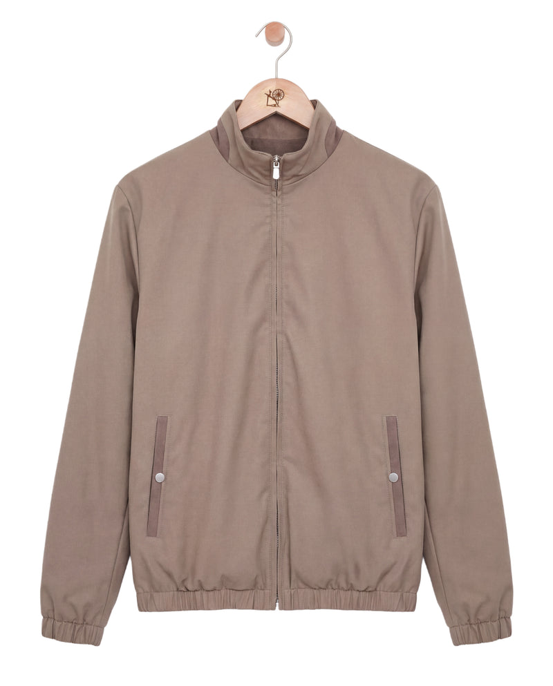 Brown jacket on a hanger against a white background
