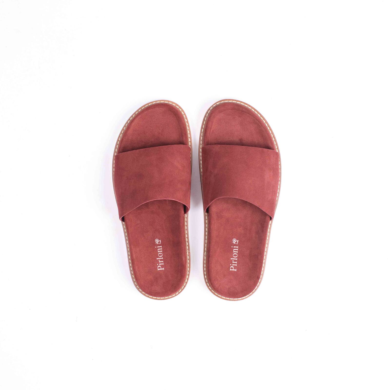 Red slippers with comfortable fit and stylish casual everyday footwear design
