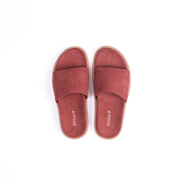 Red slippers with comfortable fit and stylish casual everyday footwear design
