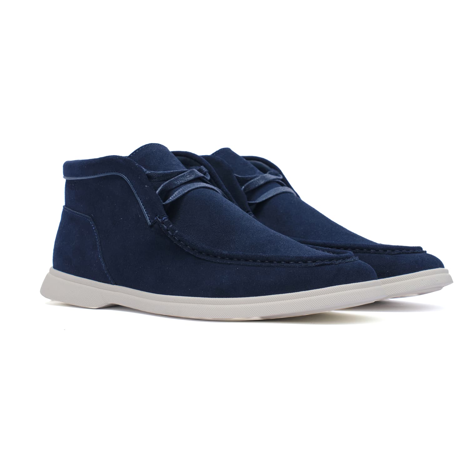 Pair of blue suede shoes on a white background
