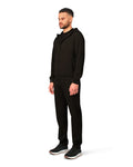 Man wearing a black tracksuit on a white background