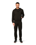 Man wearing a black tracksuit on a white background