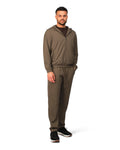 Man wearing a brown tracksuit on a white background
