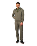 Man wearing a green tracksuit on a white background