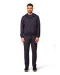 Man wearing a navy tracksuit on a white background