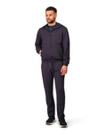Man wearing a navy tracksuit on a white background