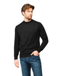 Man wearing a black sweater and blue jeans on a white background